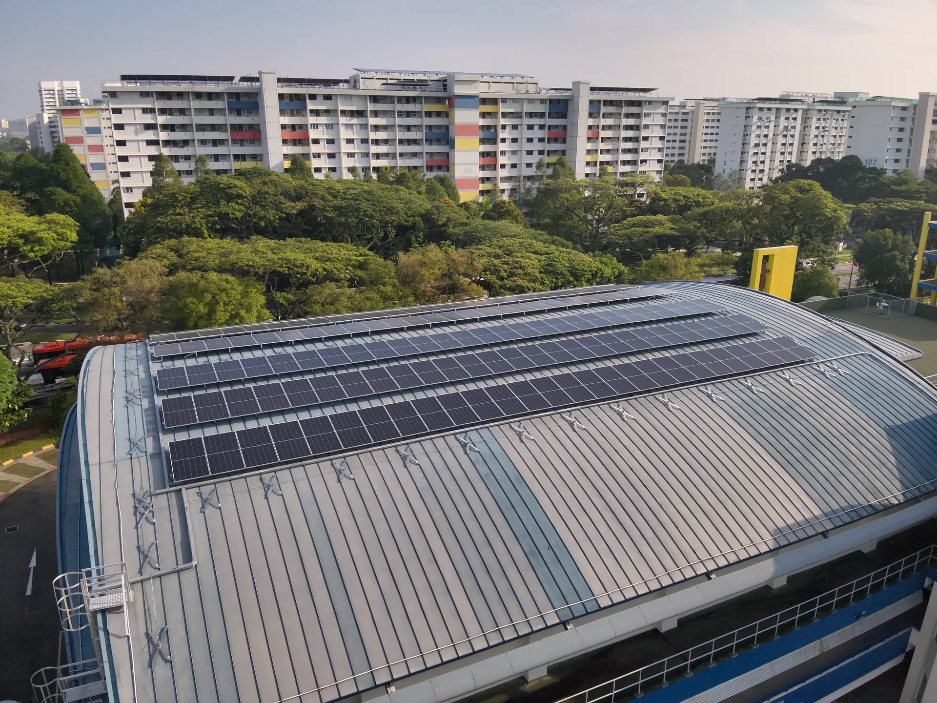 Education solar, Geylang Methodist Secondary School curved PV-clad roof in Singapore residential precinct